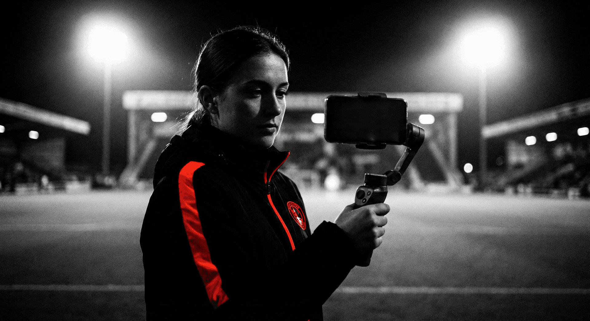 Female creator filming handheld content for a sports campaign